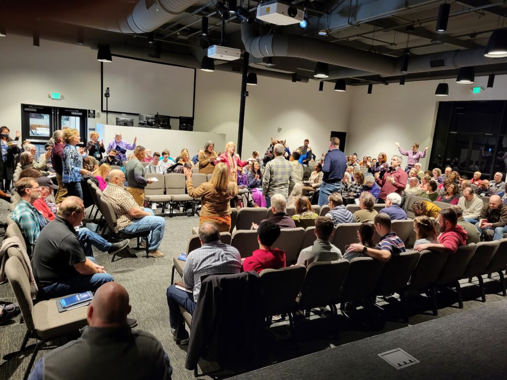 many people praying and praising God at the Northern California Prayer Summit